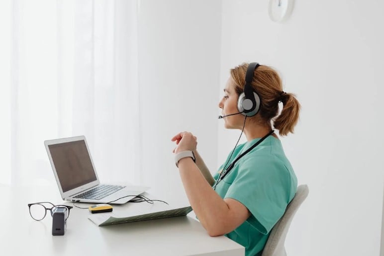 A doctor conducting a therapy session using a video conferencing tool. Source: Pexels