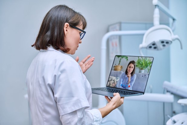 A doctor talking to a patient over a video call. Source: Envato Elements